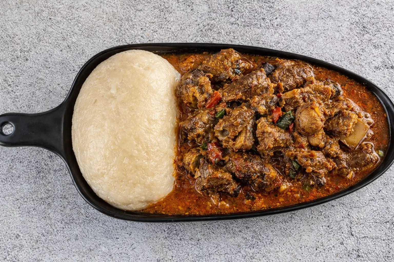 Fufu with Goat Meat - Traditional Nigerian specialty at The Tantalizers African House Edmonton